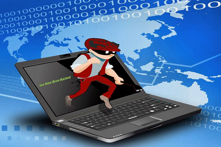 Ilustración en la que aparece un ladrón enmascarado saliendo de un ordenador portátil.